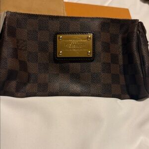 Louis Vuitton Eva Pochette in the Damier Ebene canvas